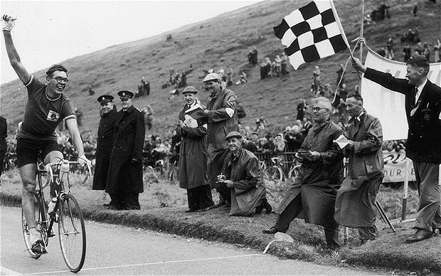 Booty takes the chequered flag to win the 120mile road race during the Empire Games in Cardiff in July 1958 Photo KEYSTONE GETTY